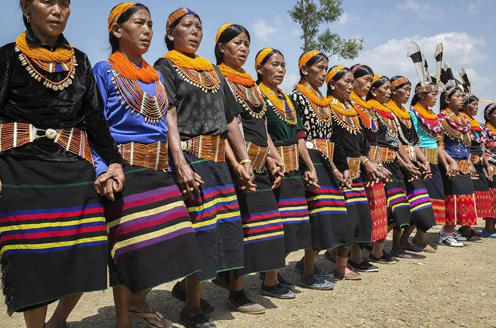 A line of women in festival dress during a village celebration in Nagaland