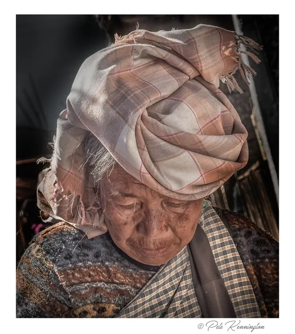 An elderly Khasi woman in a headscarf at the Sohra market