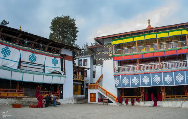 Painted monastery buildings around a courtyard