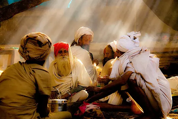 Sadhus gathered in warm light at Parasuram Kund